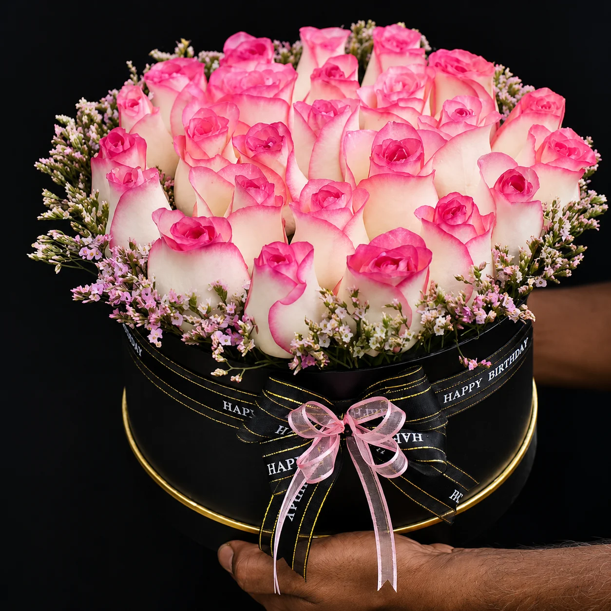 Luxury pink and white rose bouquet in a black birthday hatbox