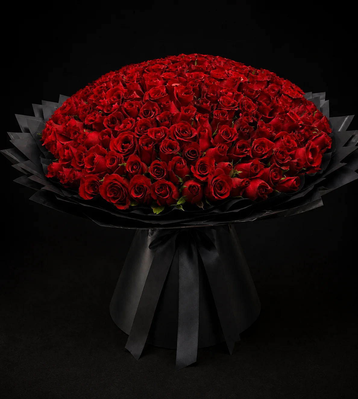 Large red rose basket arrangement with greenery