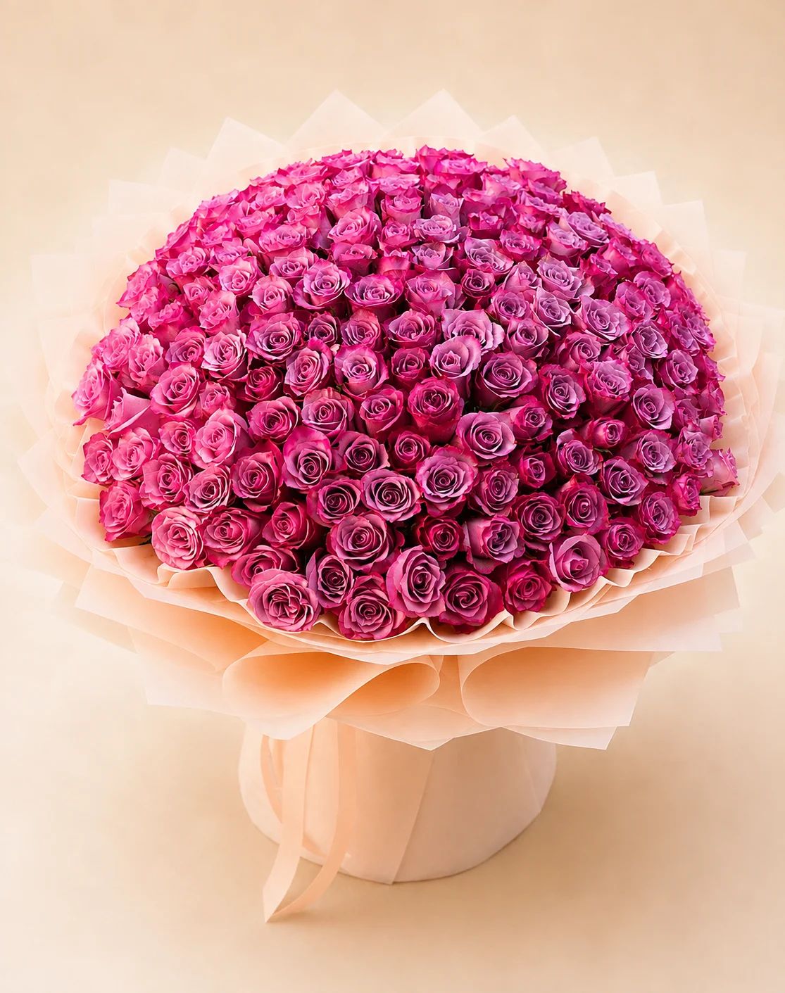 Soft pink roses arranged in a full, elegant bouquet for a sweet and romantic touch.