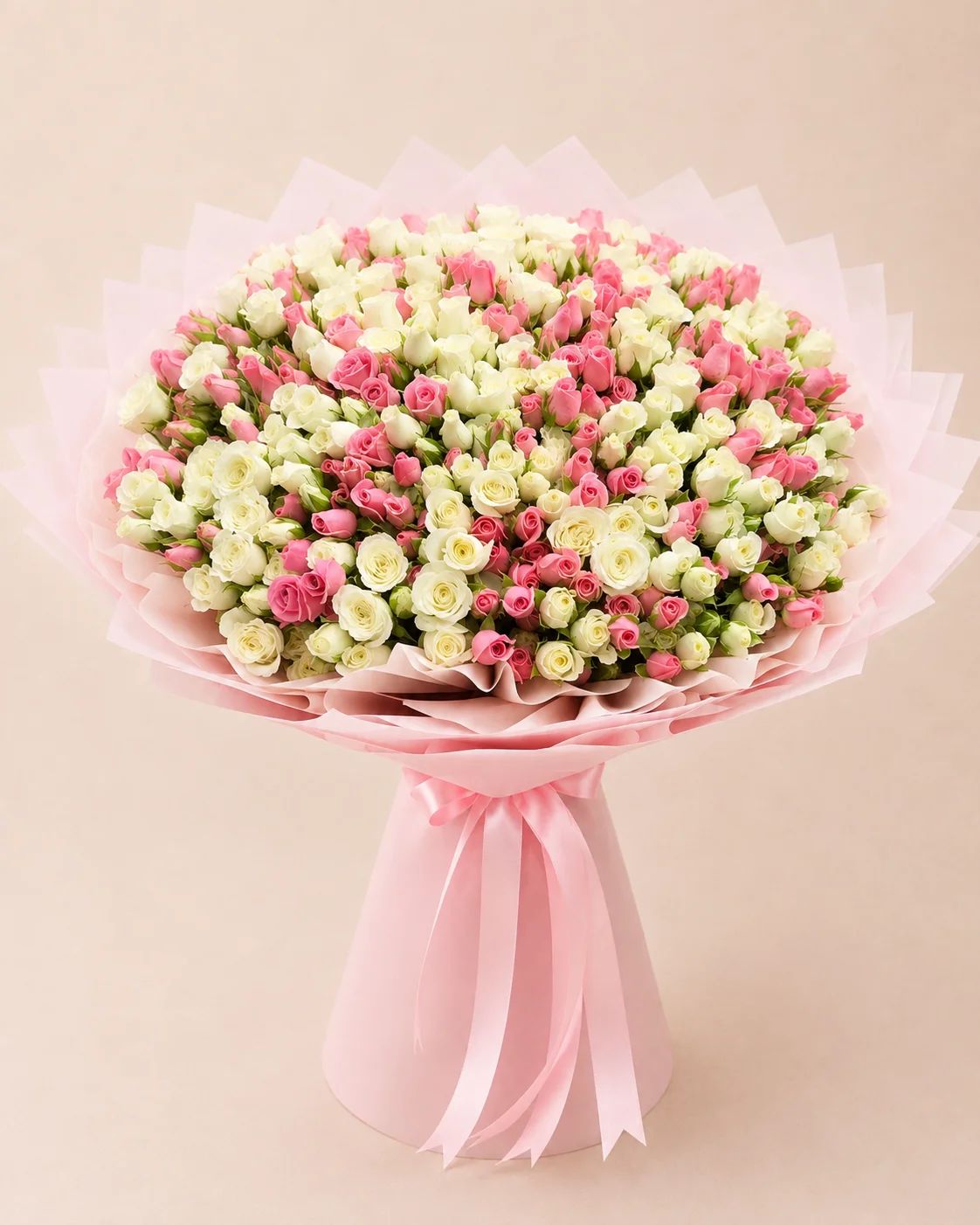 A cheerful mix of colorful roses in vibrant pink, orange, yellow, red, and cream tones. Designed to bring warmth, happiness, and celebration to any special occasion.