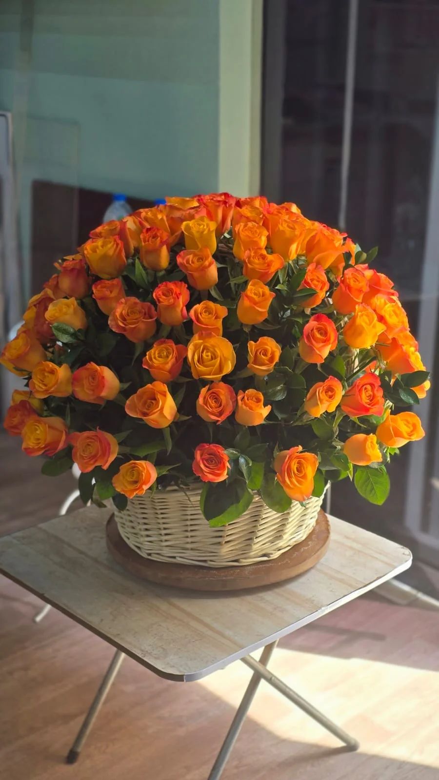 A vibrant basket of warm golden-yellow roses for joyful celebrations.