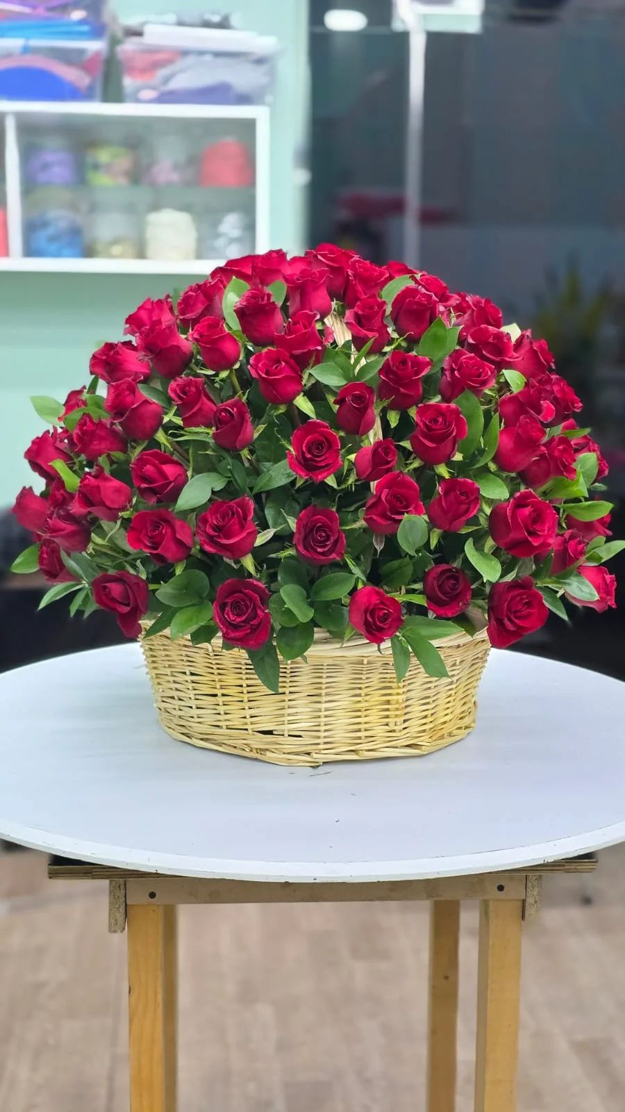 A bold and luxurious basket filled with beautiful red roses.