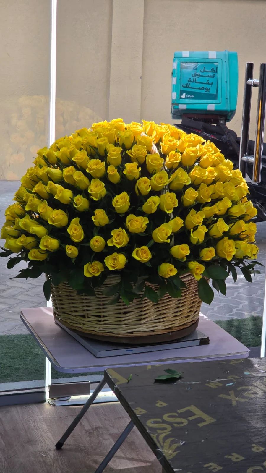 A vibrant basket of bright yellow roses for joyful celebrations.
