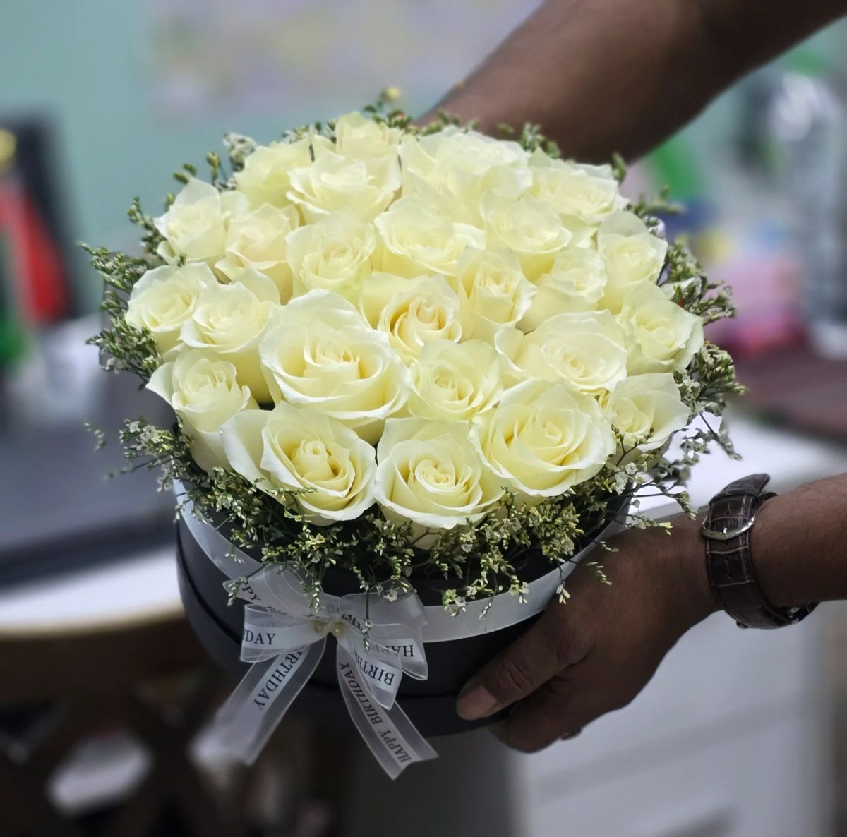A fresh and elegant basket filled with beautiful white  roses.