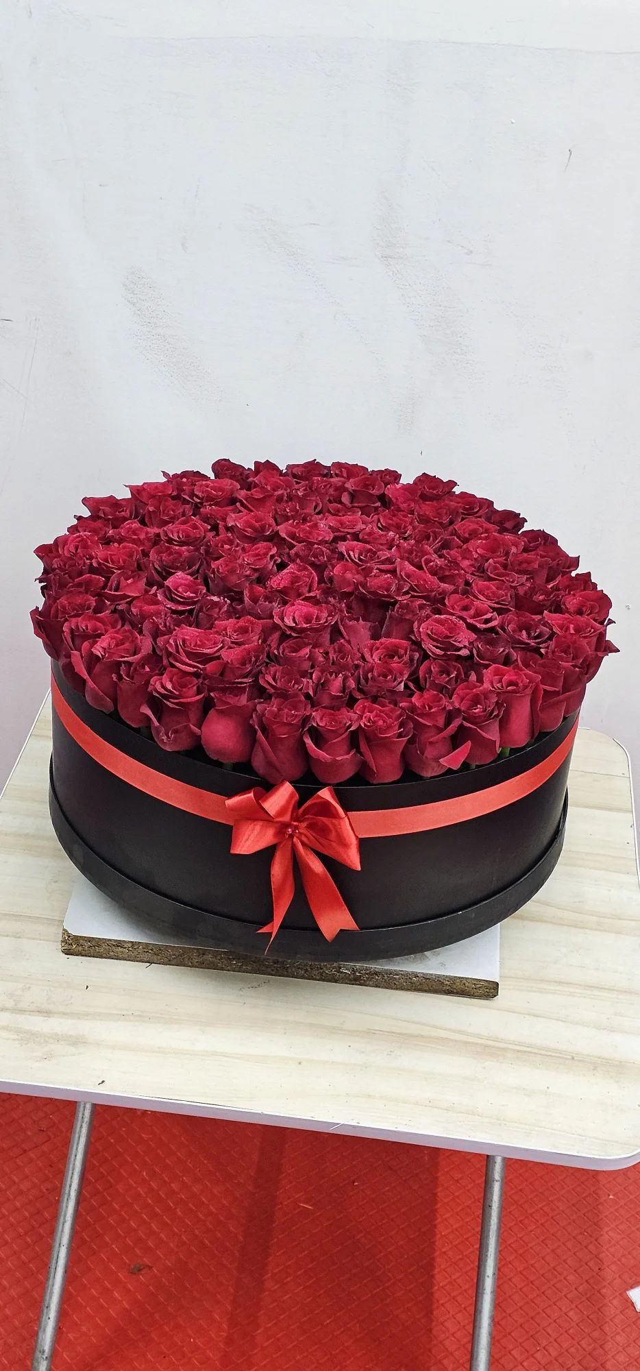 A classic luxury box filled with passionate red roses.