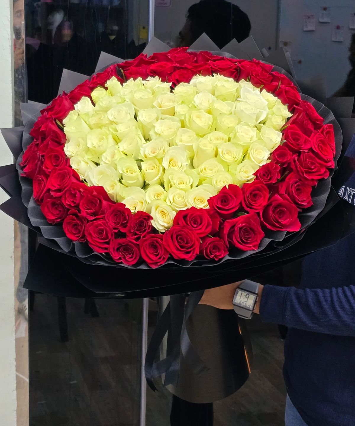 A personalized rose bouquet designed with the letter of your choice.